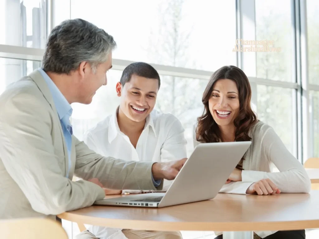 three professionals, including pedrovazpaulo business consultant, collaborating on business charts and graphs around a table, showcasing teamwork and strategy development in a modern office setting.